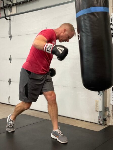 Knoxville boxing instructor teaching a boxing class from his home