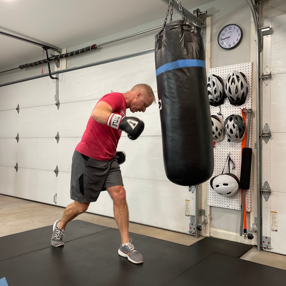 Knoxville boxing instructor teaching a boxing class from his home